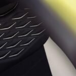 Close-up of Bentley Torcal black leather upholstery featuring decorative diamond-pattern stitching and perforated leather.