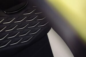 Close-up of Bentley Torcal black leather upholstery featuring decorative diamond-pattern stitching and perforated leather.