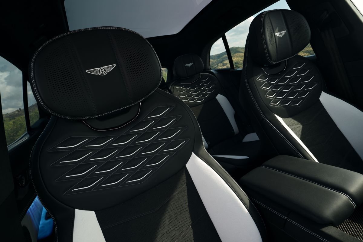 Bentley Torcal interior showing black and white leather seats with diamond-pattern detailing and embroidered Bentley emblems.