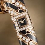 Detailed view of the Jaeger-LeCoultre Calibre 101 Chain featuring its miniature watch and diamond-set pink-gold bangle.