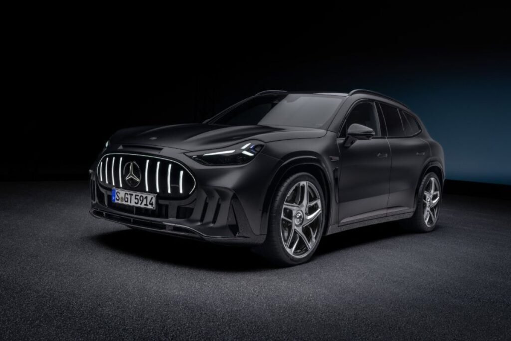 Black Mercedes-AMG GT SUV photographed from the front three-quarter angle, showing its illuminated grille and alloy wheels.