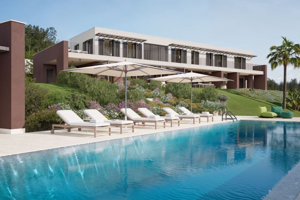 Contemporary Sicilian villa with a large outdoor swimming pool, sun loungers and landscaped Mediterranean gardens.