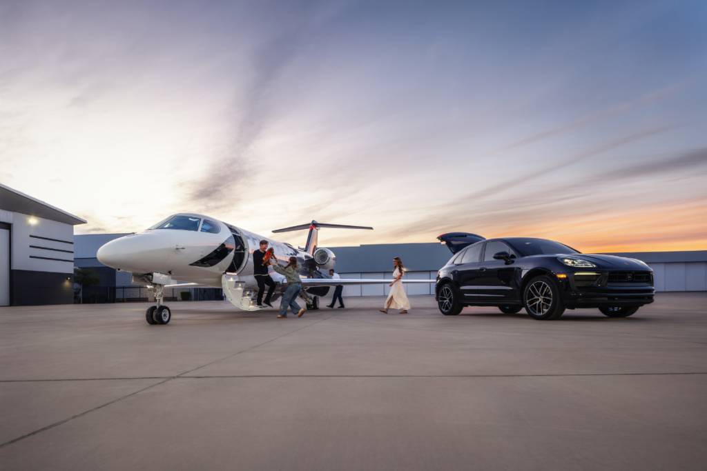 SyberJet SJ36 – Luxury Private Aviation Experience SyberJet SJ36 private jet on an airport apron beside a luxury SUV, with passengers boarding at sunset.