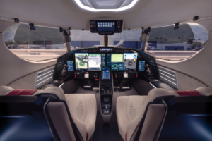 SyberJet SJ36 SyberVision cockpit showing digital flight displays, pilot controls and panoramic windscreen.