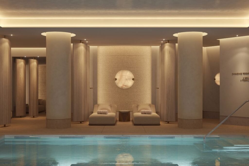 The hydrotherapy pool at Waldorf Astoria London – Admiralty Arch, featuring relaxation loungers, soft lighting and contemporary spa interiors.